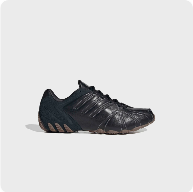 Black Low-Top Sneakers – Contrast Stitching & Brown Sole Accents