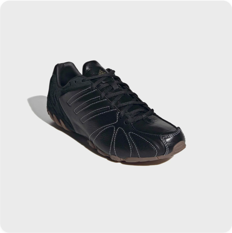 Black Low-Top Sneakers – Contrast Stitching & Brown Sole Accents