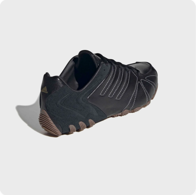 Black Low-Top Sneakers – Contrast Stitching & Brown Sole Accents