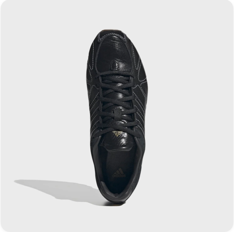 Black Low-Top Sneakers – Contrast Stitching & Brown Sole Accents