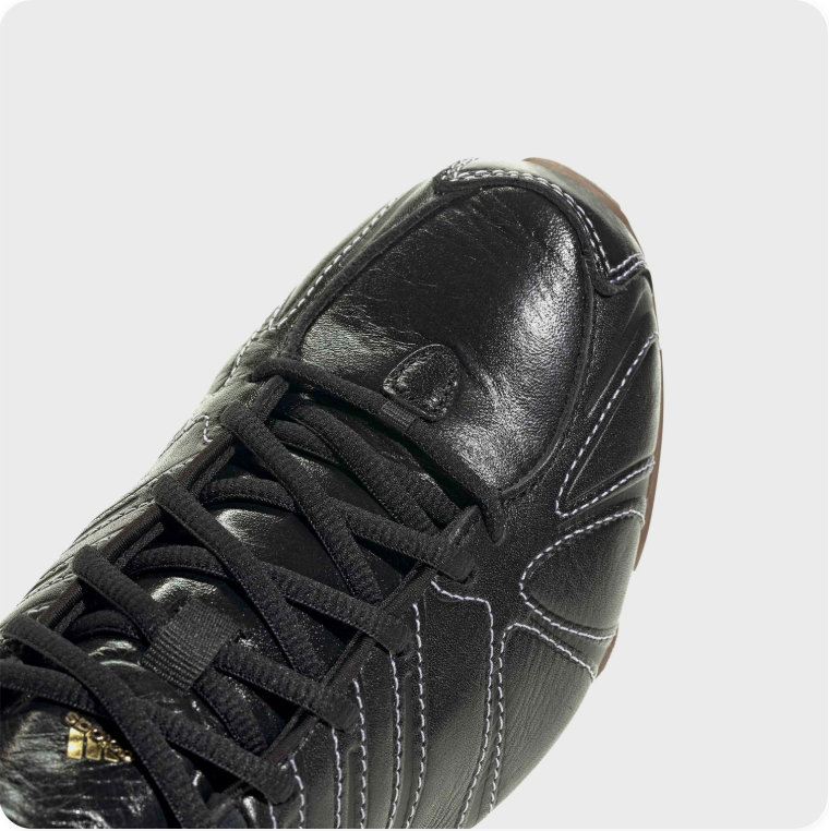 Black Low-Top Sneakers – Contrast Stitching & Brown Sole Accents
