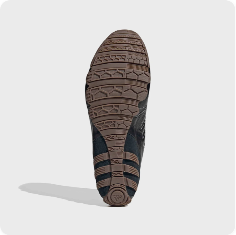 Black Low-Top Sneakers – Contrast Stitching & Brown Sole Accents