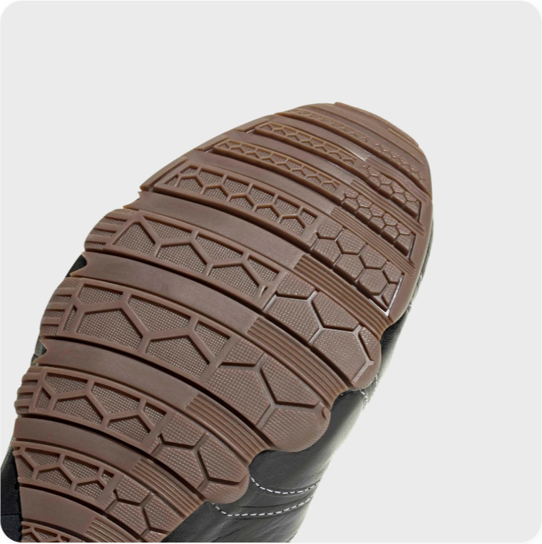 Black Low-Top Sneakers – Contrast Stitching & Brown Sole Accents